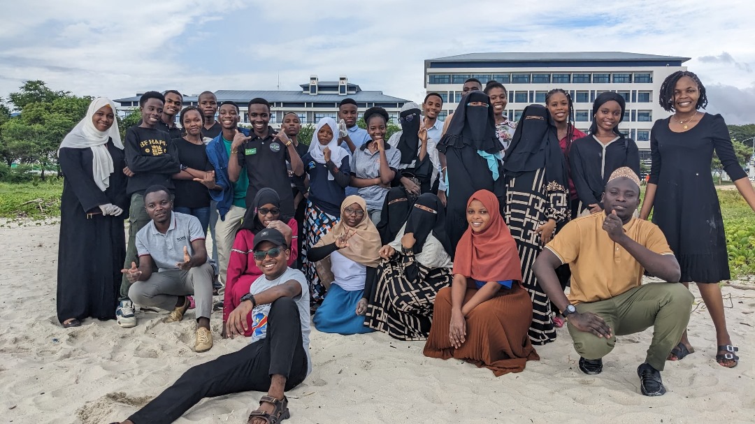 Community planting trees at sunrise